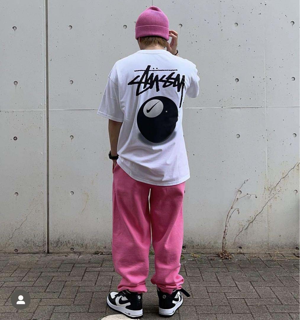 White NIKE X STUSSY 8 BALL T-shirt featuring logo graphics and a relaxed fit.