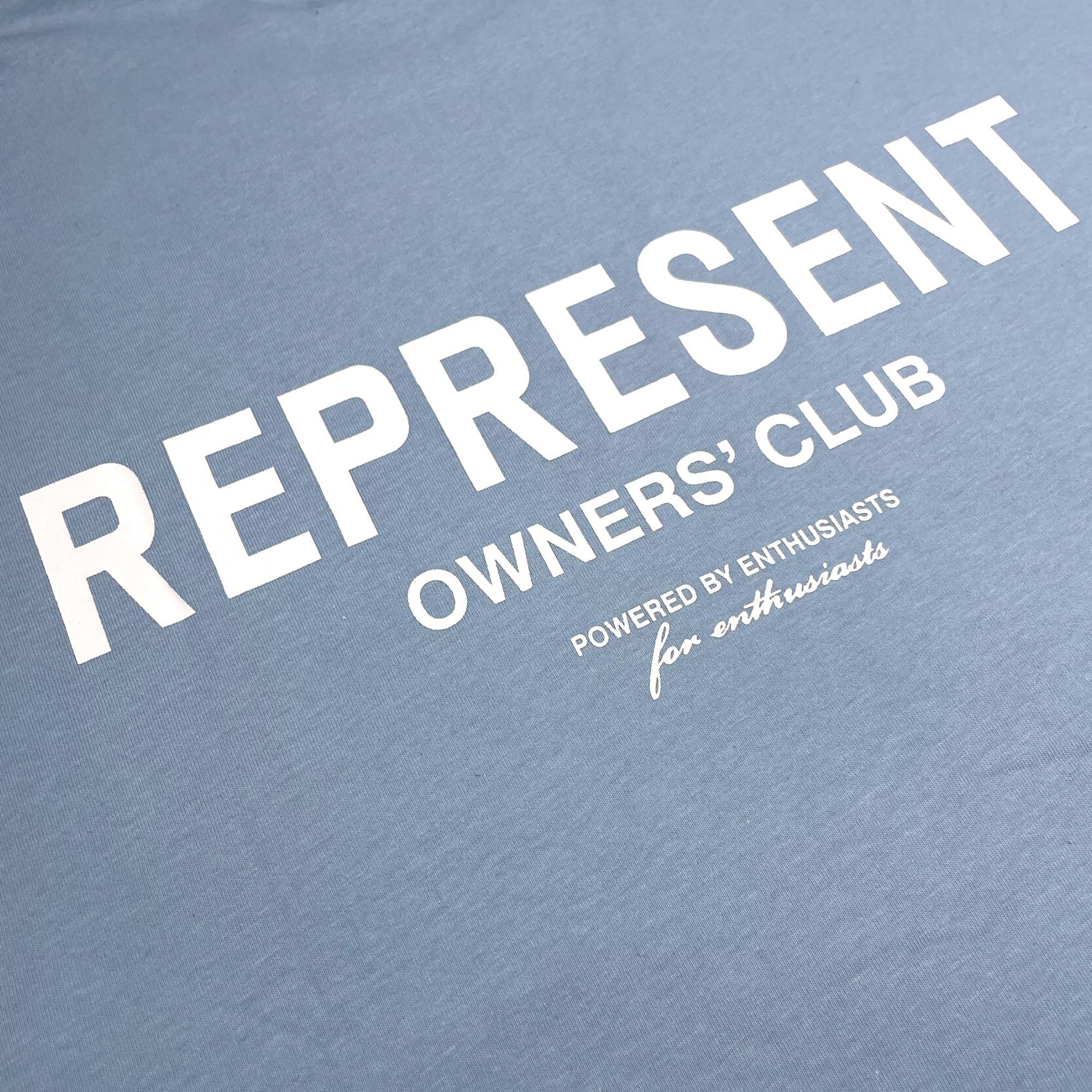 Powder blue REPRESENT OWNERS CLUB T-shirt featuring a relaxed fit and logo print on the front.