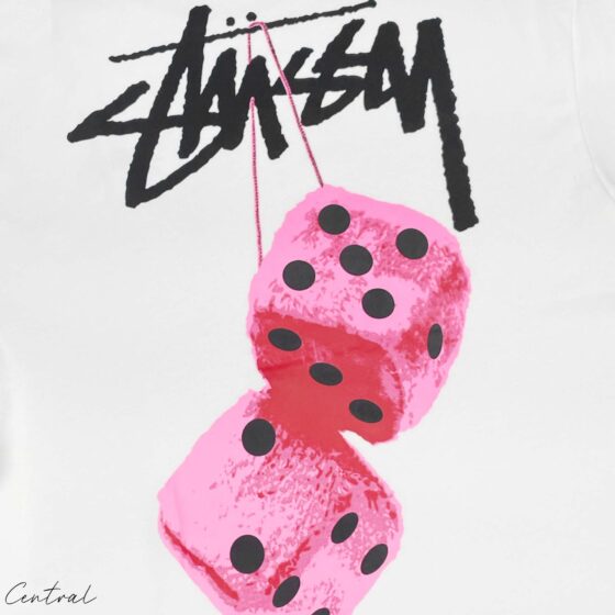 Stussy Fuzzy Dice Tee featuring a graphic design on a casual black t-shirt from Central ae, displayed on a plain background.