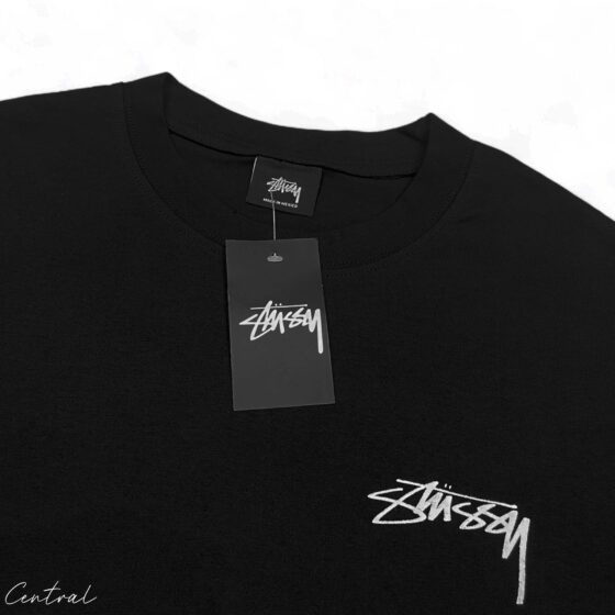 Black Stussy Fuzzy Dice Tee featuring a playful graphic on soft fabric, ideal for casual streetwear style.