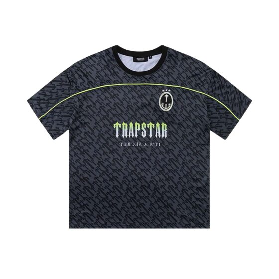 Black and lime Trapstar monogram jersey t-shirt featuring bold logo design and comfortable fit.