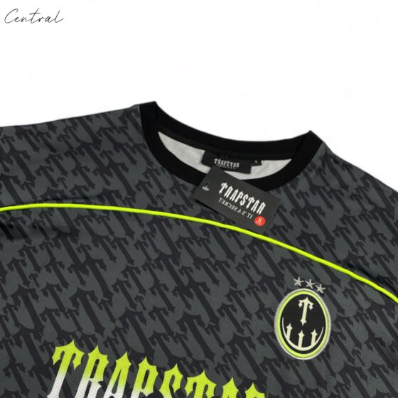 Black and lime Trapstar Monogram Jersey t-shirt with bold logo design, displayed on a plain background.