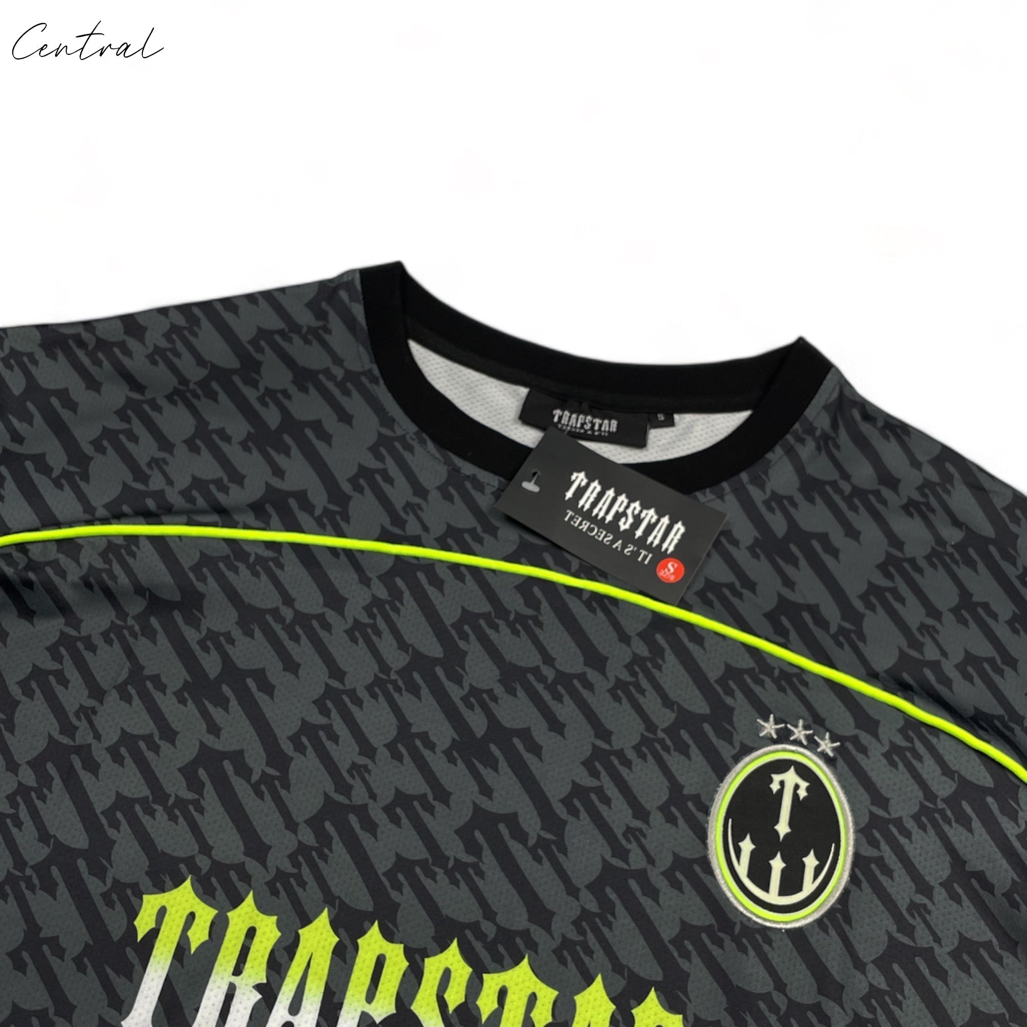 Black and lime Trapstar Monogram Jersey t-shirt with bold logo design, displayed on a plain background.