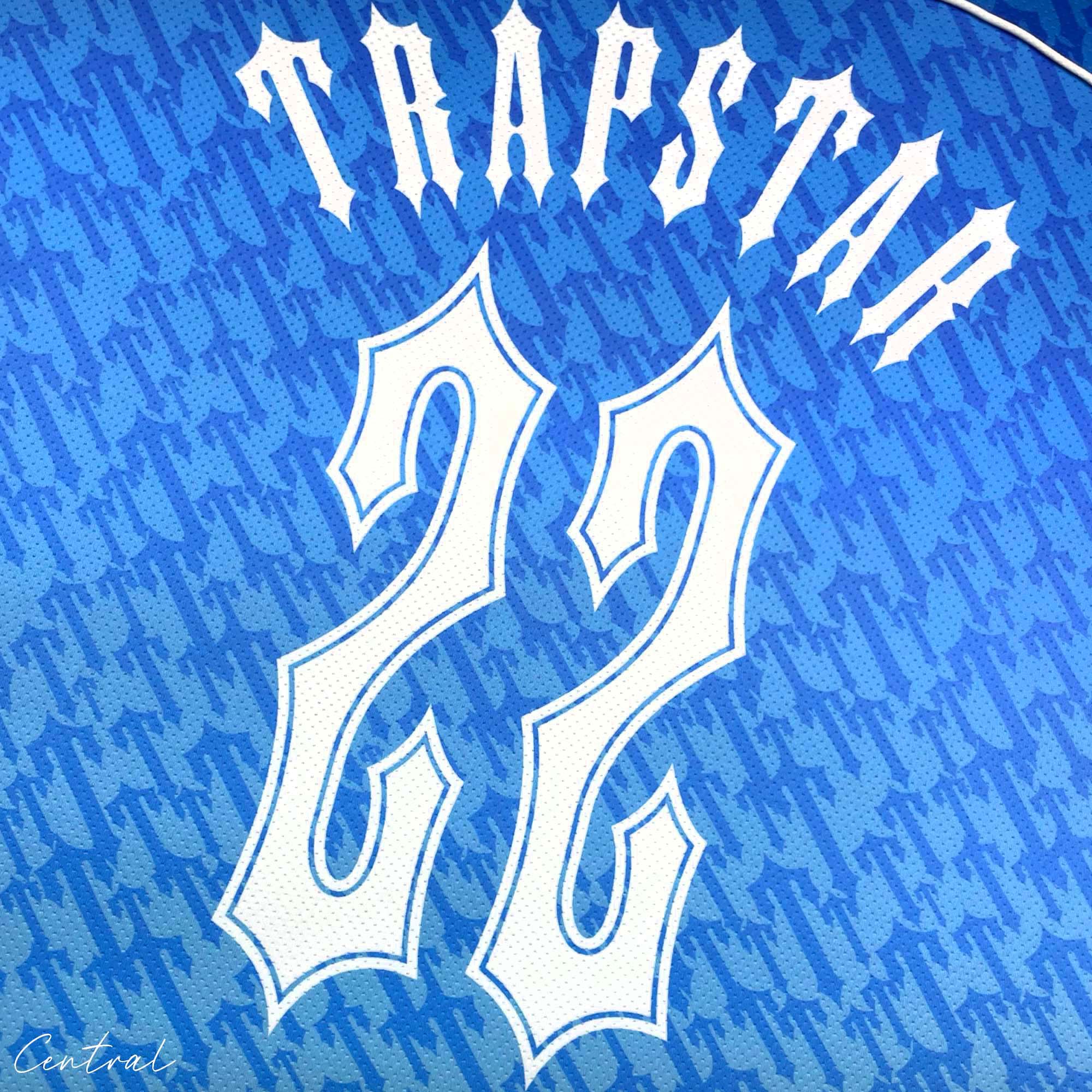 Ice blue Trapstar monogram jersey t-shirt featuring a stylish logo design on soft fabric.