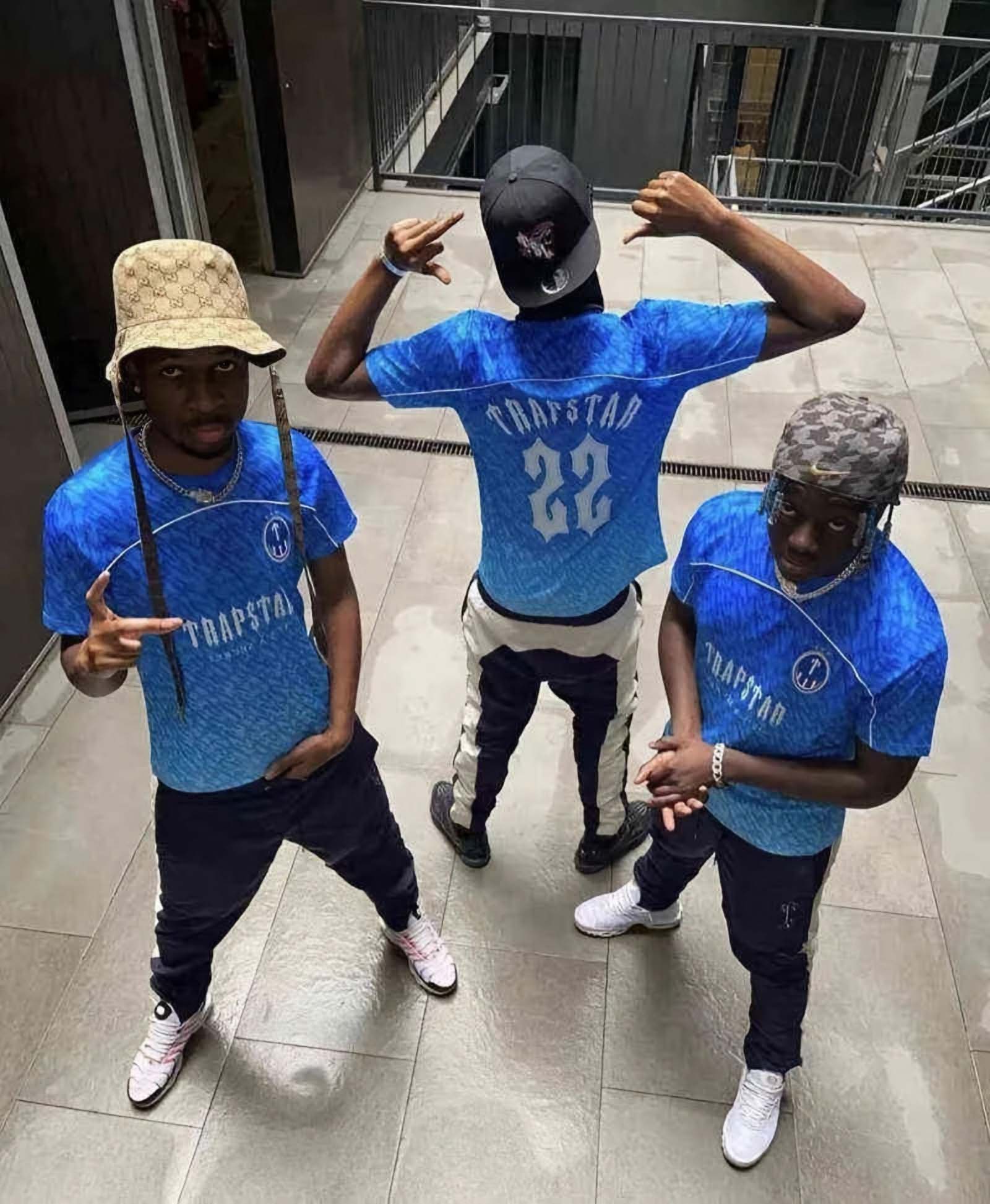 Ice blue Trapstar monogram jersey t-shirt featuring a stylish design and logo on soft fabric.