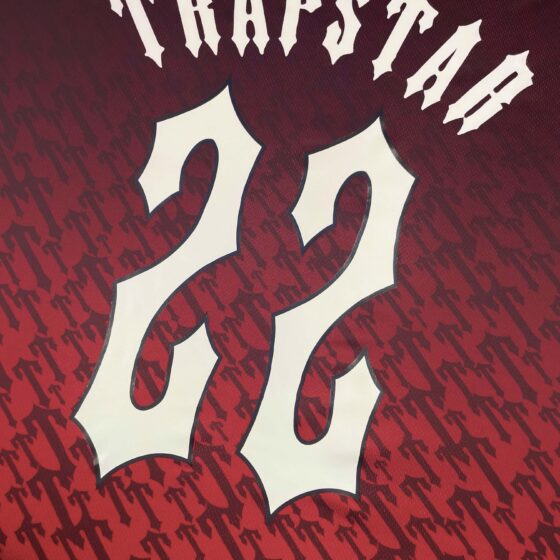 Trapstar red gradient monogram jersey t-shirt featuring bold logo design and a stylish modern fit.