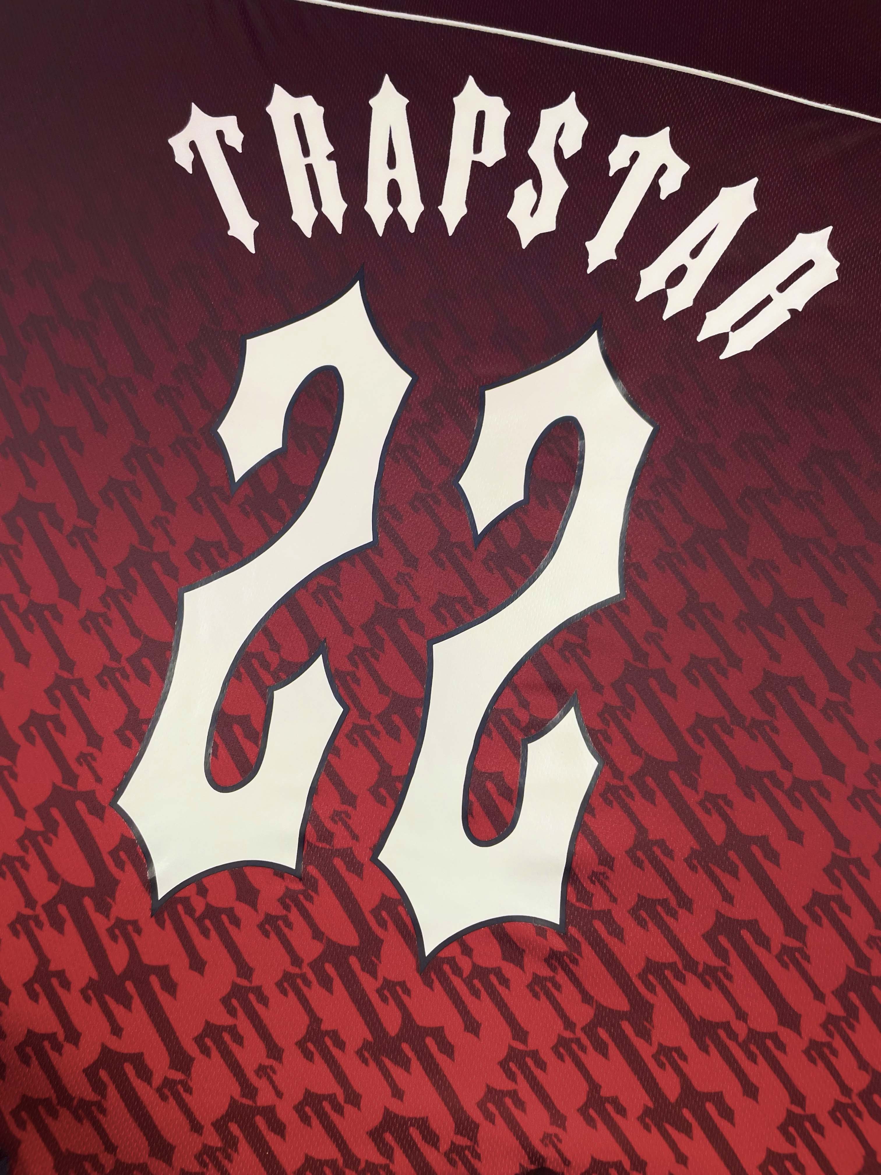 Trapstar red gradient monogram jersey t-shirt featuring bold logo design and a stylish modern fit.