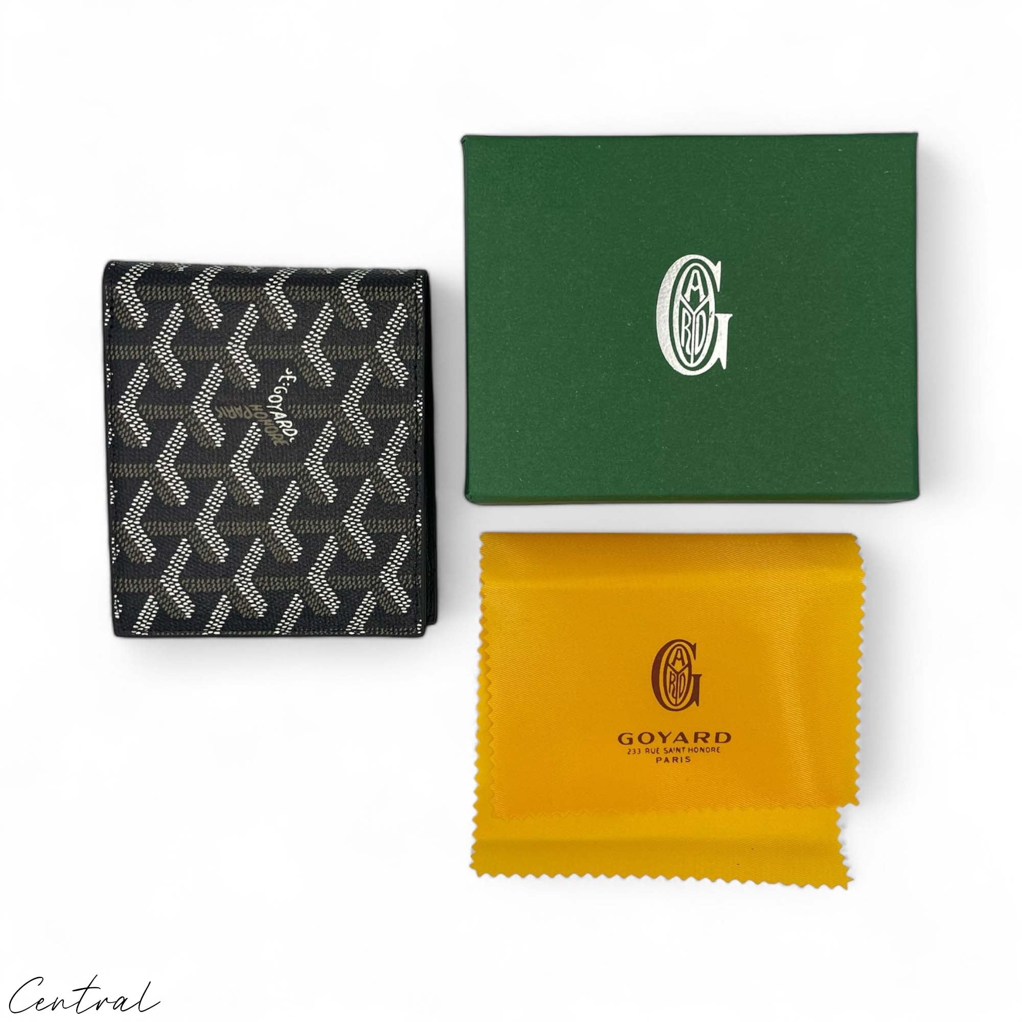 Black Goyard wallet from Central ae, featuring a sleek design and iconic logo, displayed on a textured surface.