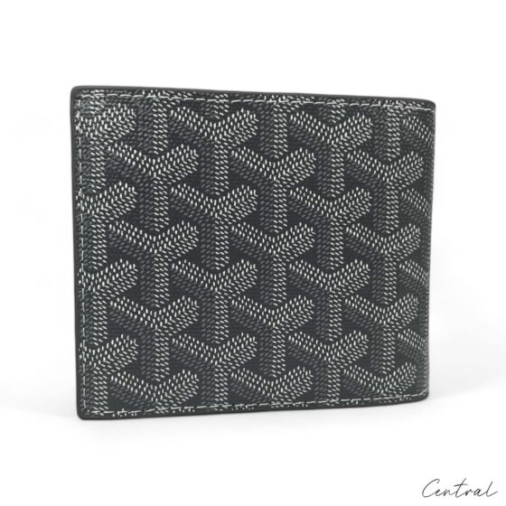 Gray Goyard wallet by Central ae with a sleek design and signature pattern showcased on a white background.
