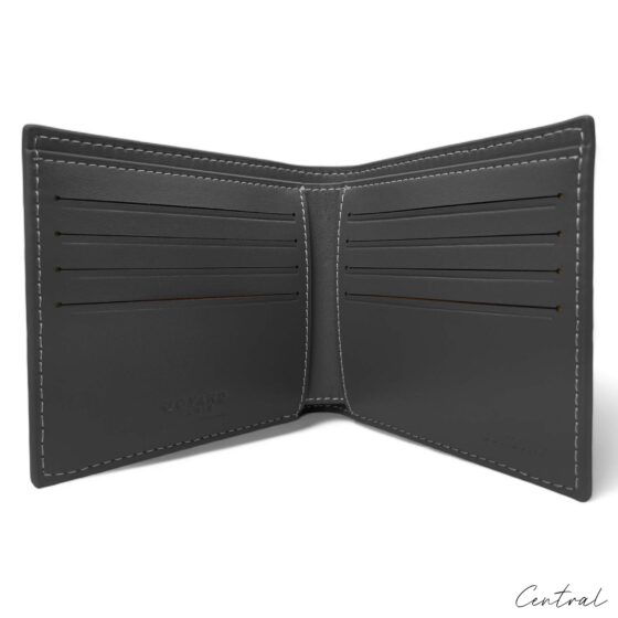 Gray Goyard wallet by Central ae, showcasing the textured exterior and iconic logo design.