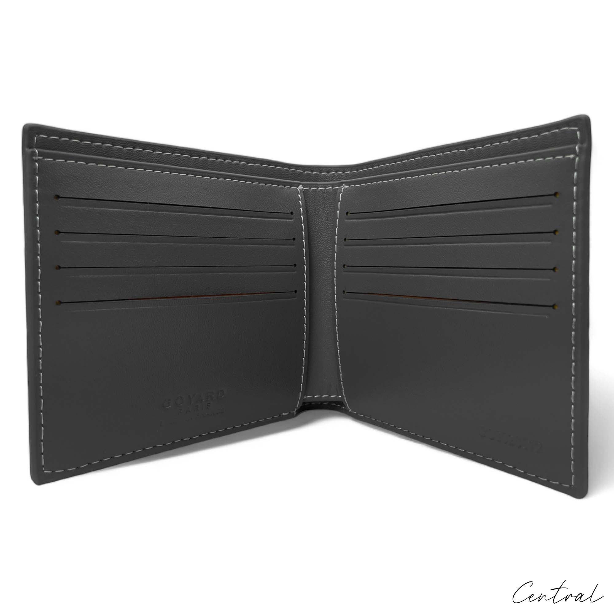 Gray Goyard wallet by Central ae, showcasing the textured exterior and iconic logo design.