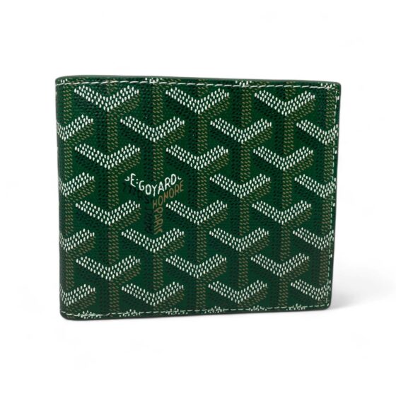 Green Goyard wallet by Central ae, featuring a sleek design and iconic logo pattern on premium material.