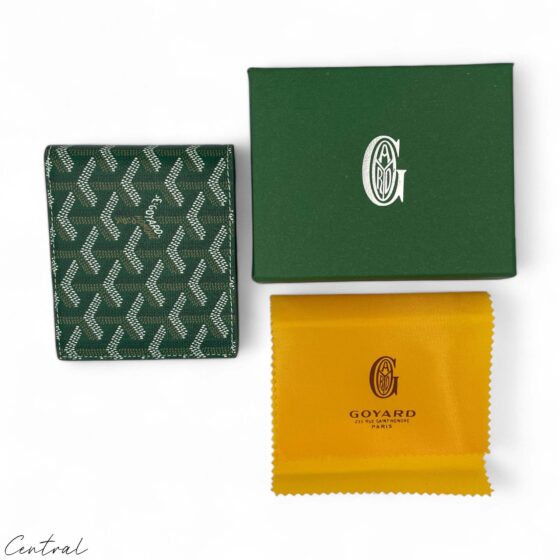 Green Goyard wallet by Central ae with a sleek design and signature pattern, displayed against a neutral background.