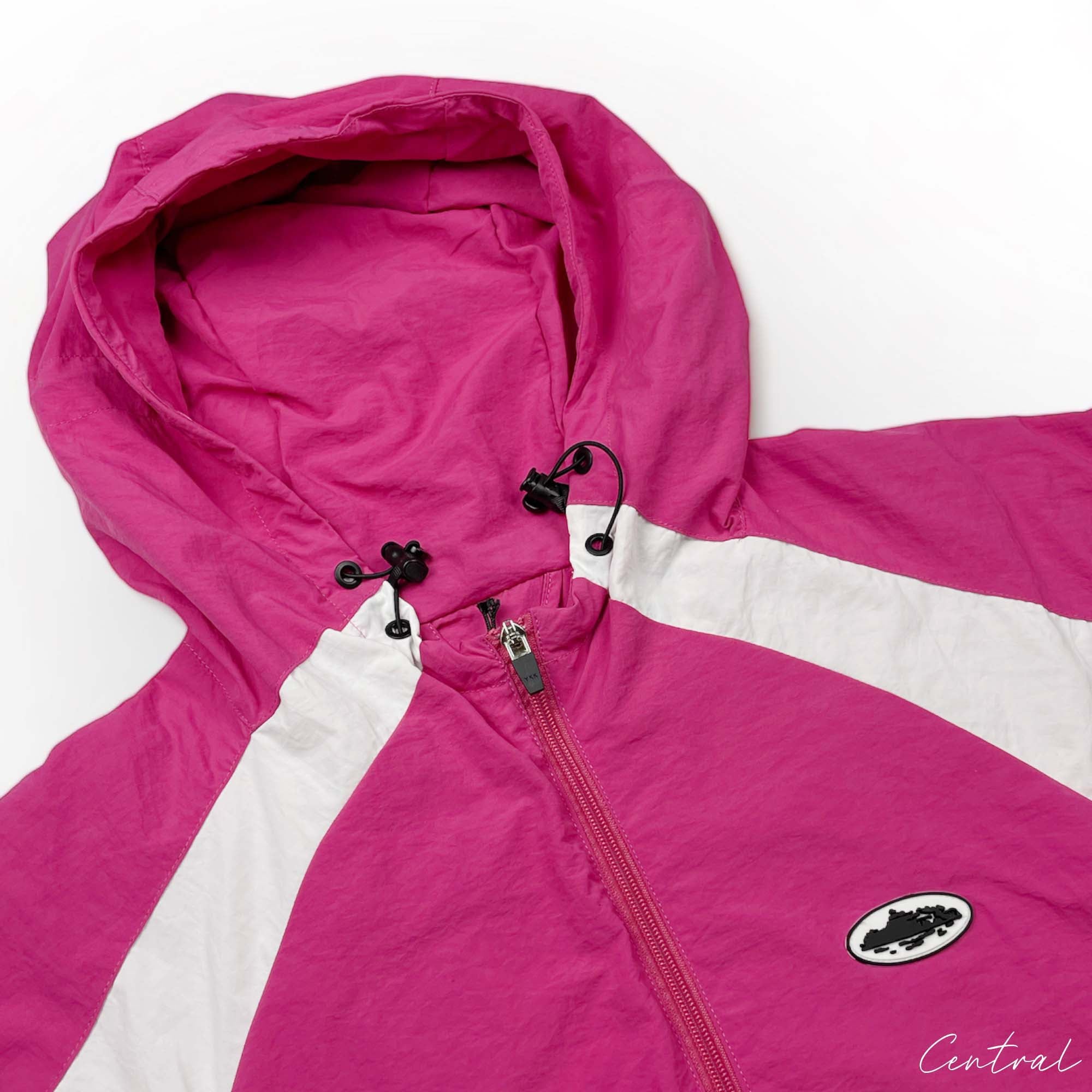 Pink Corteiz spring hoodie featuring a relaxed fit and lightweight design, perfect for casual wear.