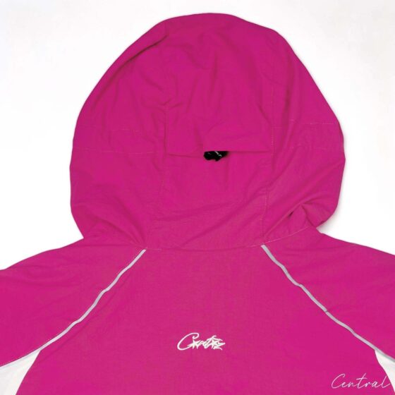 Corteiz pink spring hoodie with a relaxed fit, featuring a front zipper and drawstring hood, displayed against a neutral background.