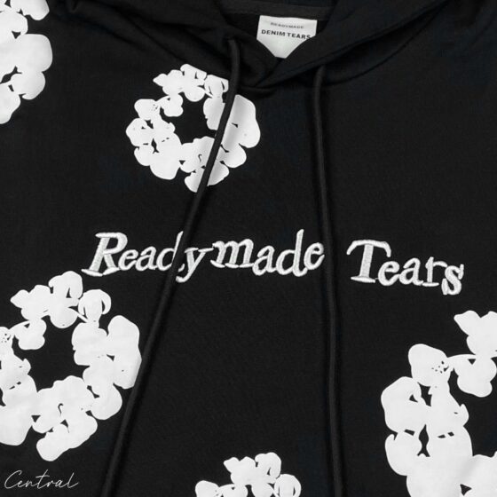 Black READYMADE x DENIM TEARS hoodie from Central displayed with a relaxed fit and unique graphic detailing.