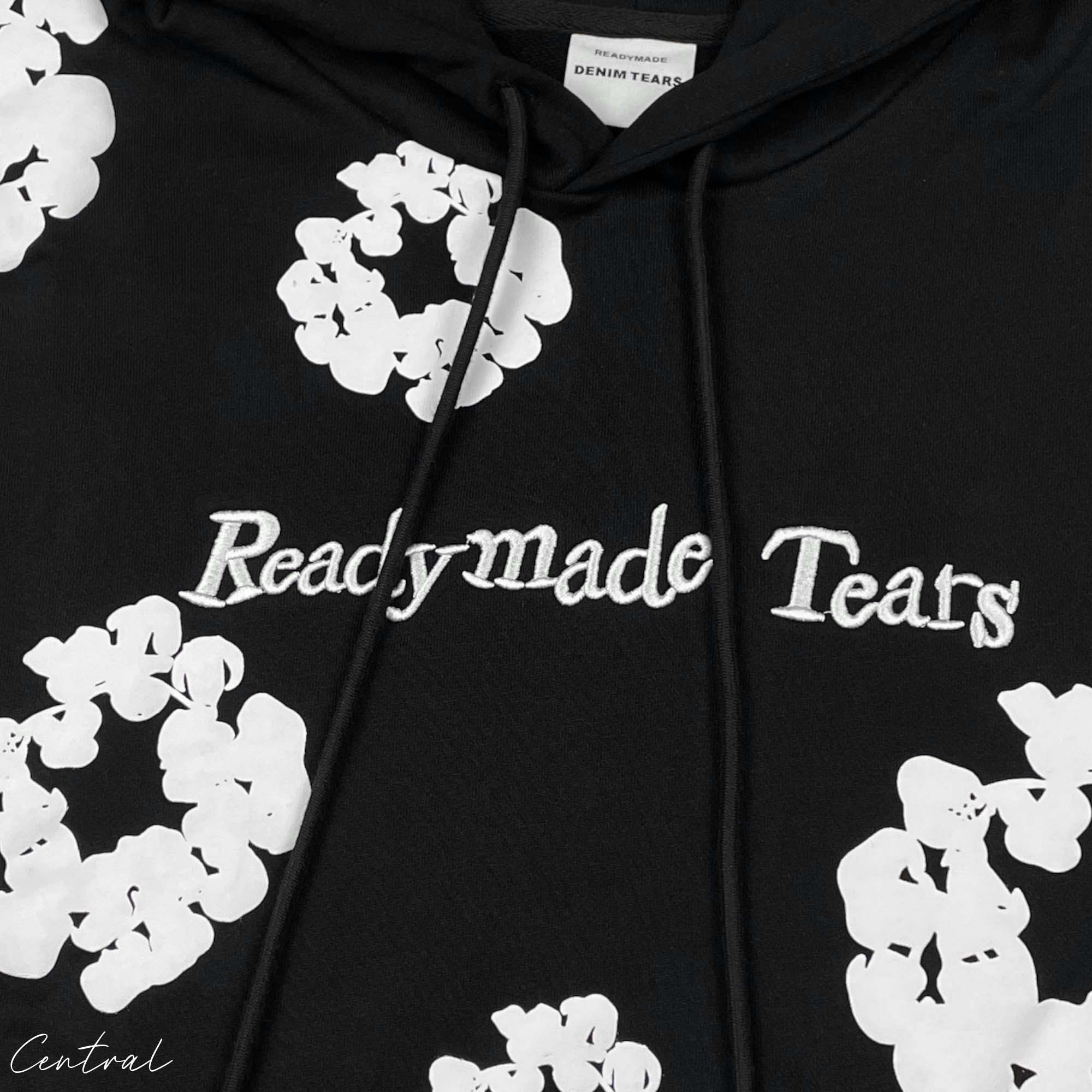 Black READYMADE x DENIM TEARS hoodie from Central displayed with a relaxed fit and unique graphic detailing.