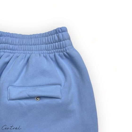 Corteiz Alcatraz baby blue sweatpants featuring a relaxed fit and central logo detail.