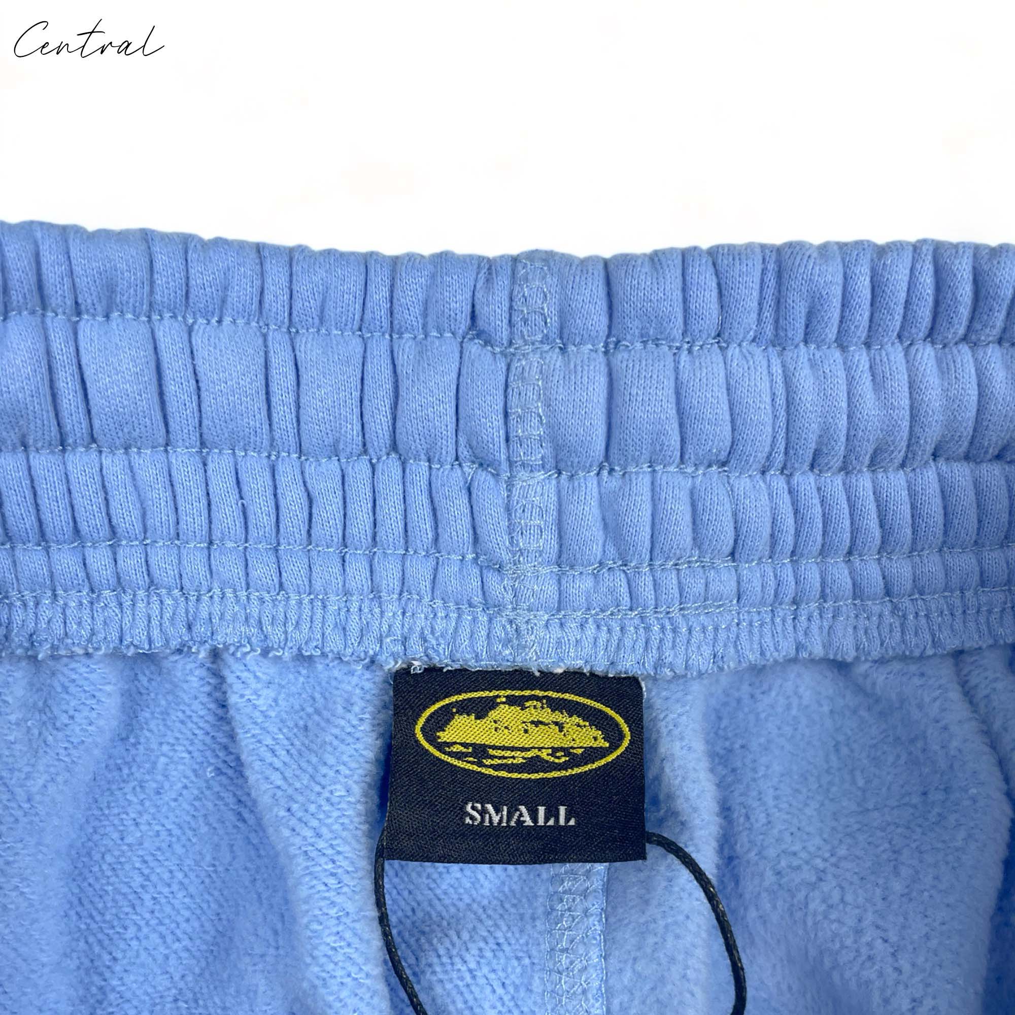 Corteiz baby blue Alcatraz sweatpants for kids, featuring a comfortable fit and soft fabric.