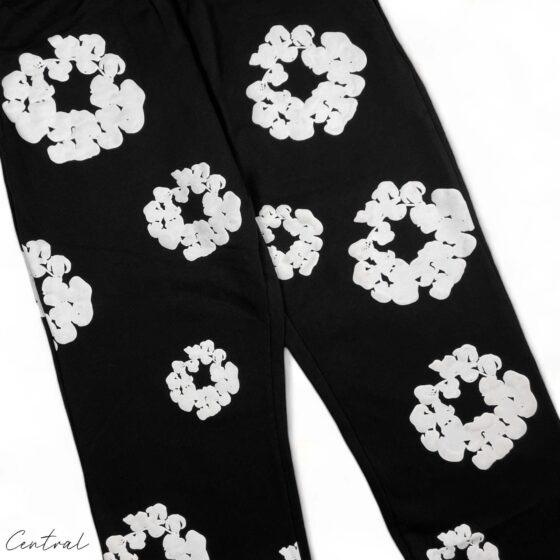 Black READYMADE x DENIM TEARS sweatpants with a relaxed fit and unique design details from the central brand.