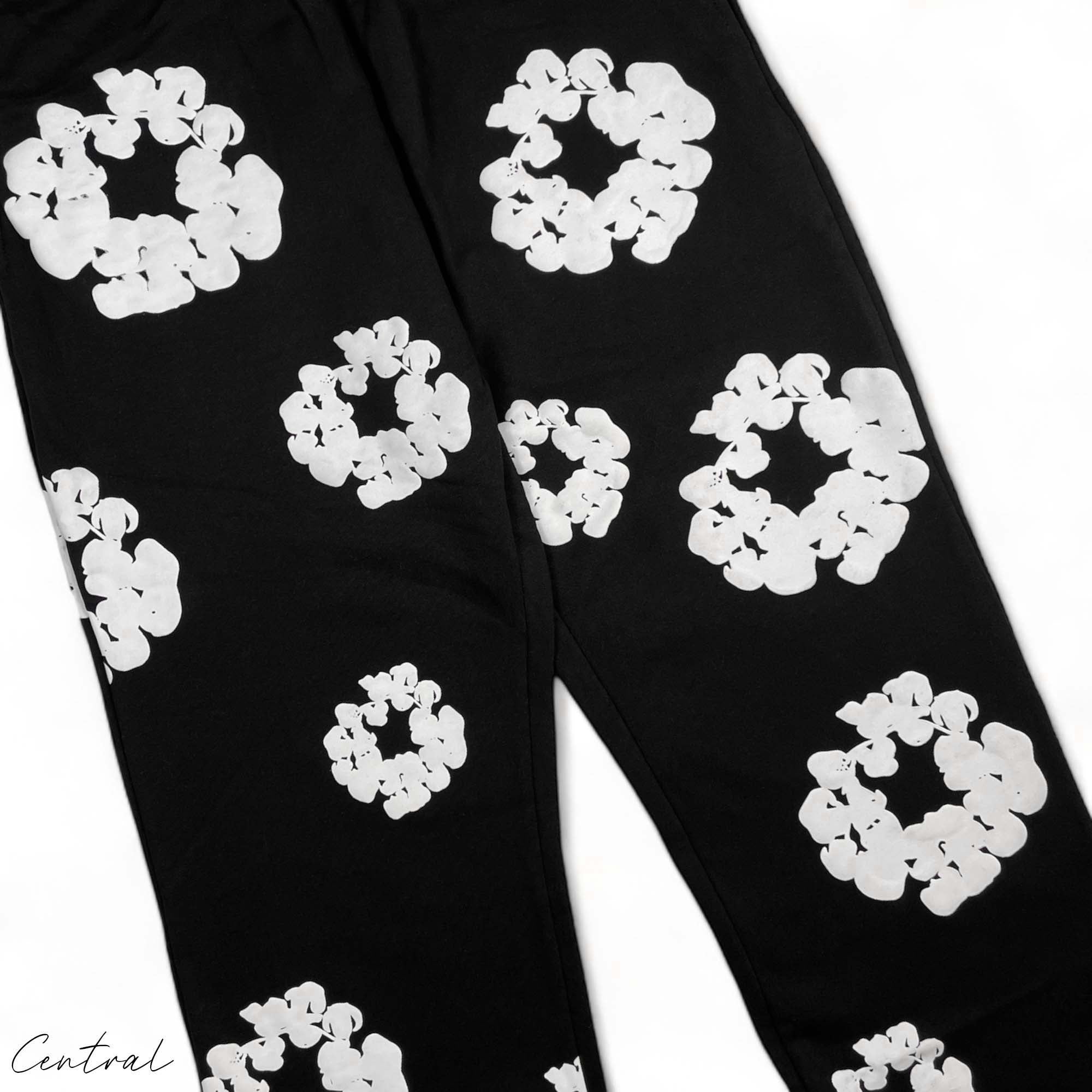 Black READYMADE x DENIM TEARS sweatpants with a relaxed fit and unique design details from the central brand.