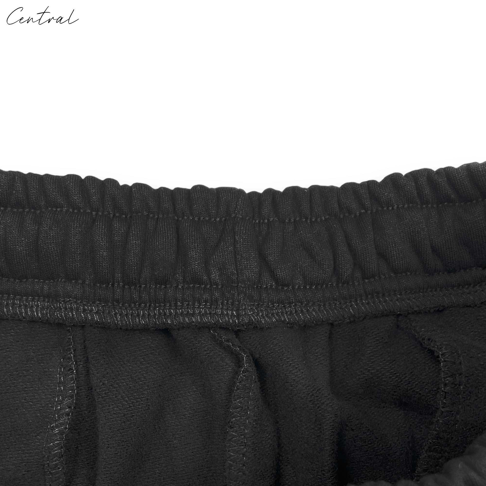 Black READYMADE x DENIM TEARS sweatpants featuring a relaxed fit and central branding detail.