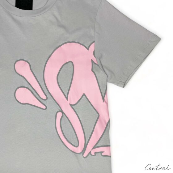 Gray and pink Syna World short set featuring a comfortable T-shirt and shorts, perfect for casual wear.