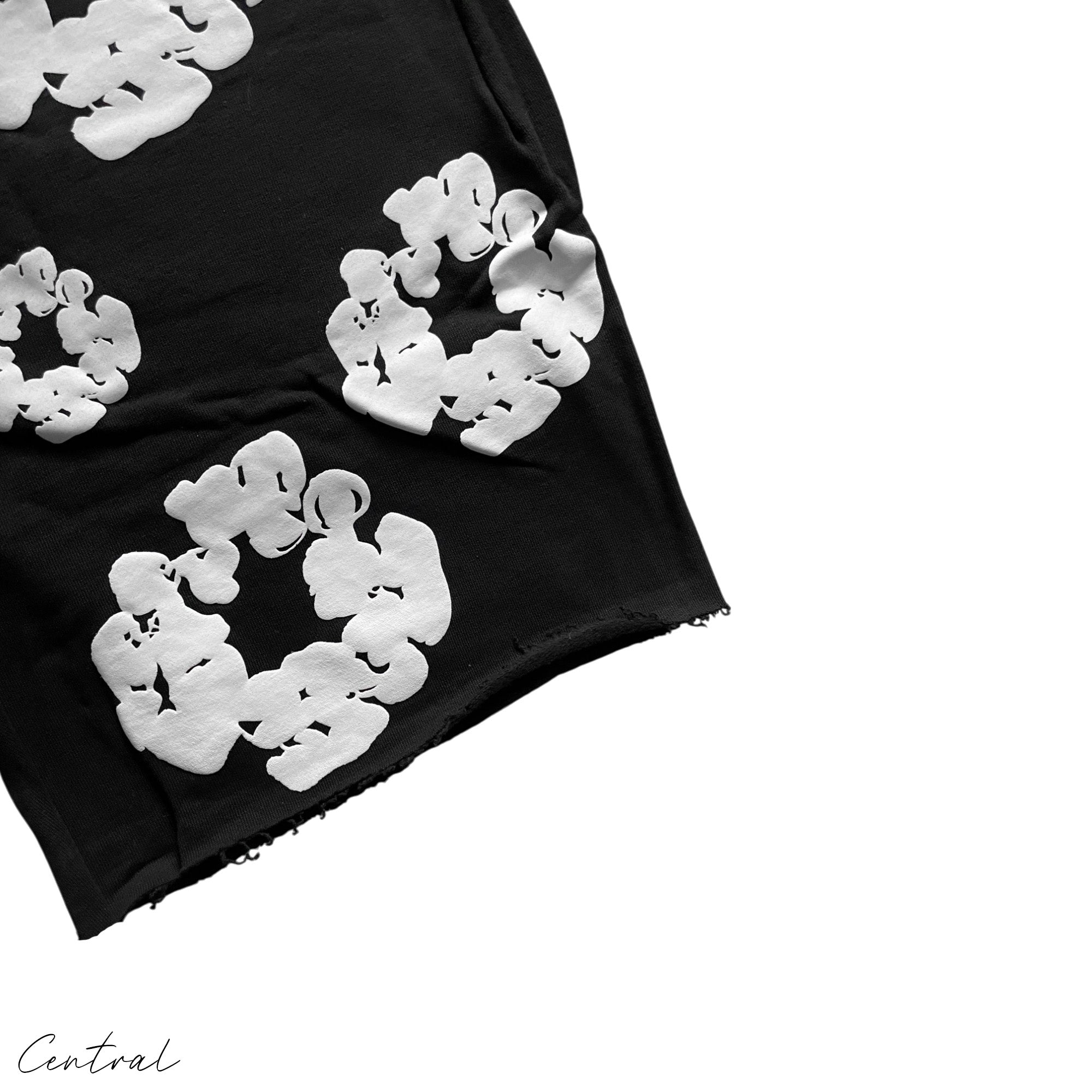 Black Denim Tears Cotton Wreath Shorts featuring a unique design and comfortable fit, displayed on a neutral background.