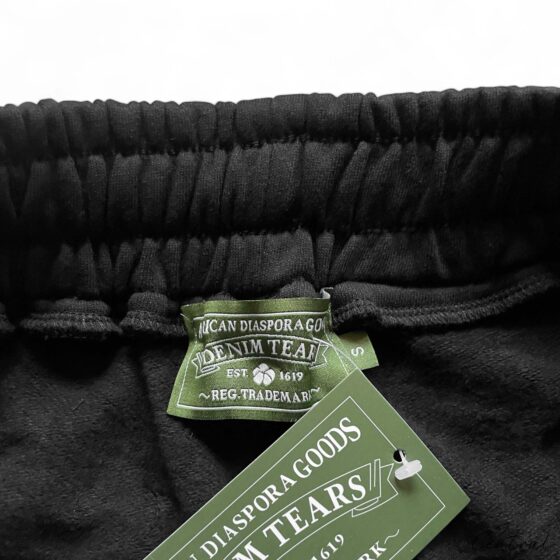 Black Denim Tears cotton wreath shorts featuring a stylish design and relaxed fit.