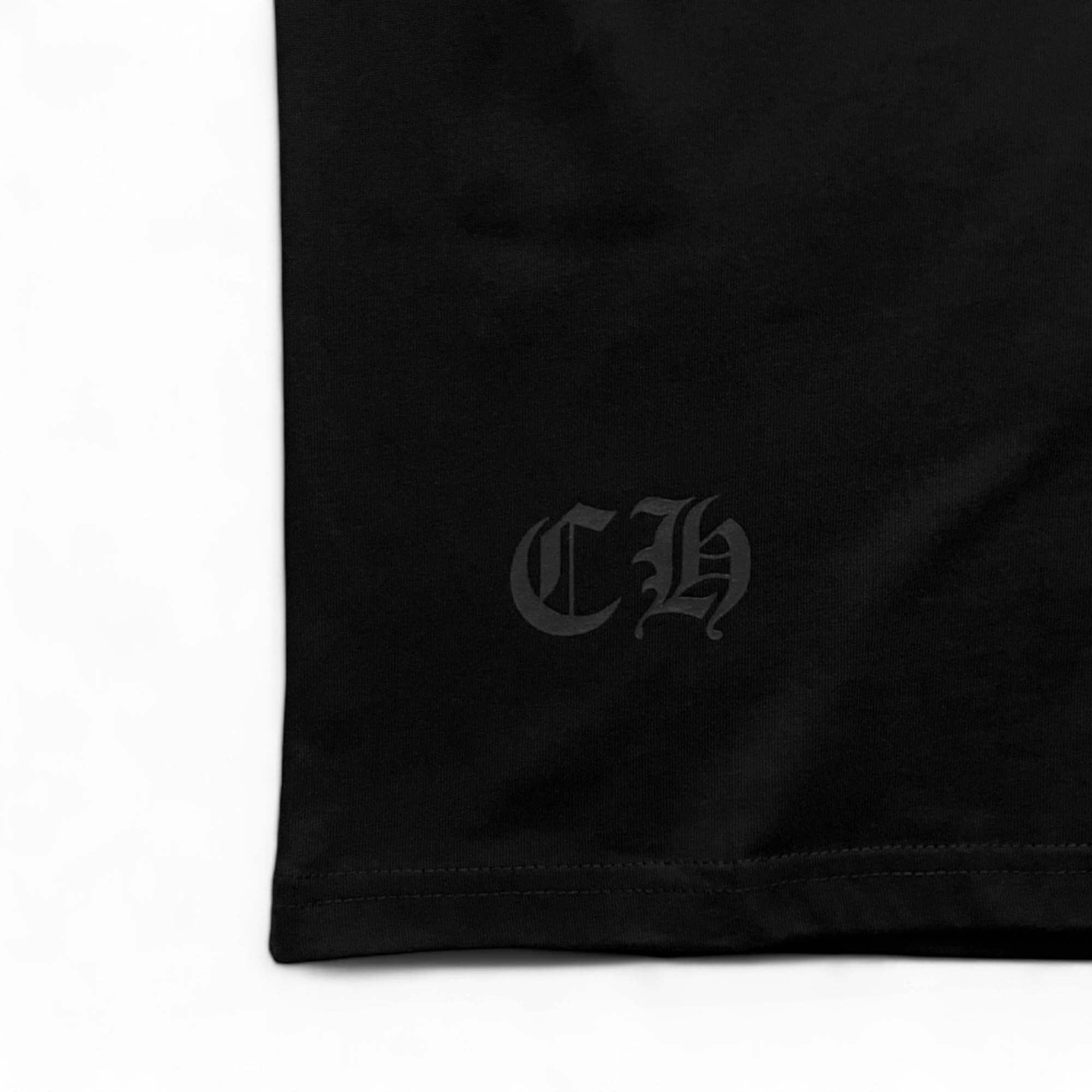 Chrome Hearts Horse Shoe logo graphic on a black T-shirt, showcasing a casual and stylish design.