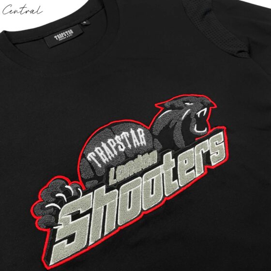 Black and red Trapstar short set featuring a t-shirt and shorts, showcasing stylish urban streetwear design.
